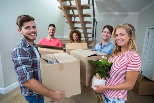 Professional man and van team preparing items for delivery in Woodside