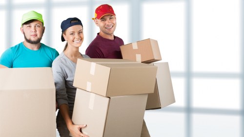 Employee using PPE while moving items in a storage facility