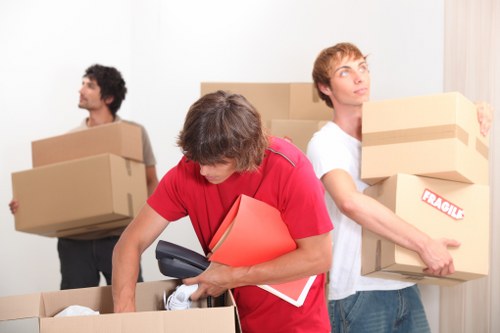 Local Woodside moving team handling furniture for a house move