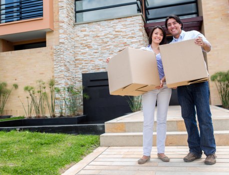 Local removals team handling furniture carefully during a Woodside home move
